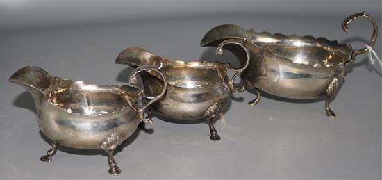 A pair of late Victorian silver sauceboats, Chester, 1900 and one other Edwardian silver sauceboat, 10 oz.